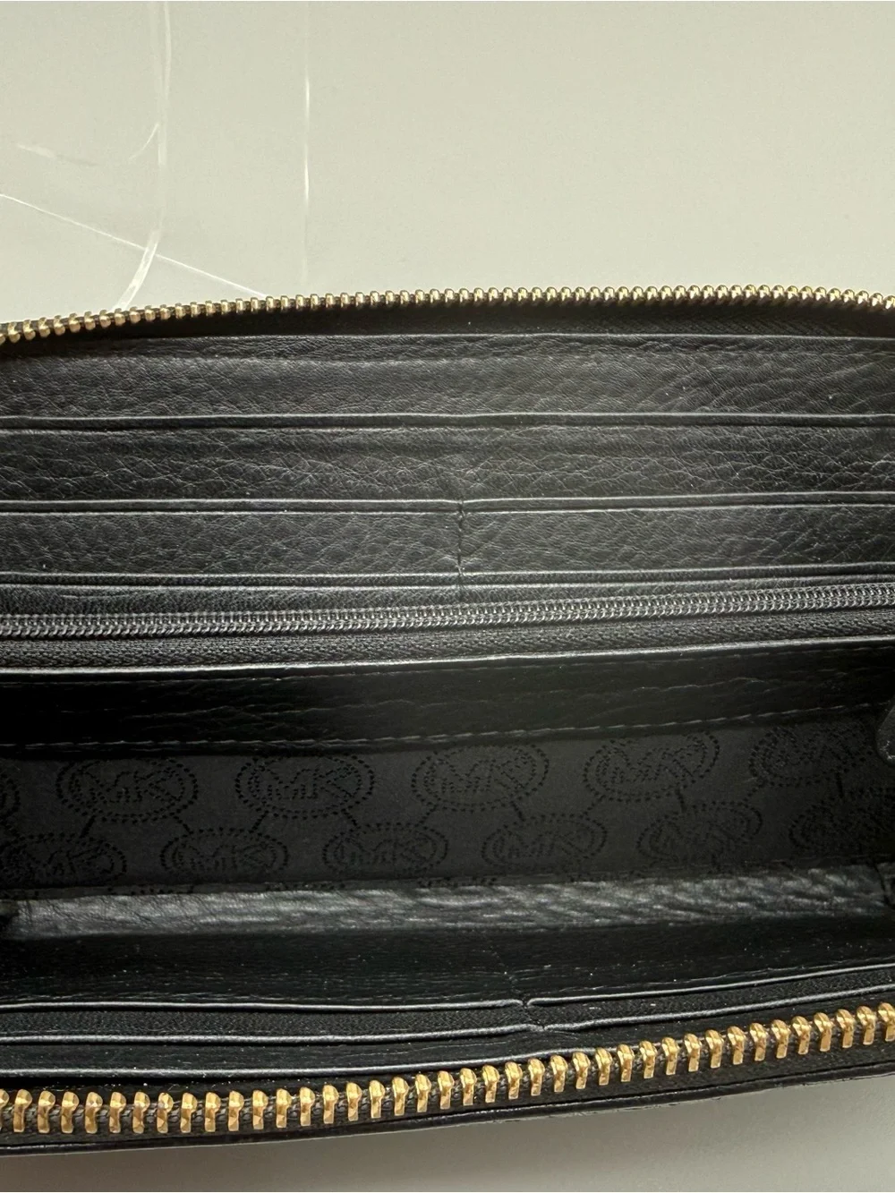 Michael Kors Black Pebbled Leather Zip Around Continental Wallet Logo Plaque